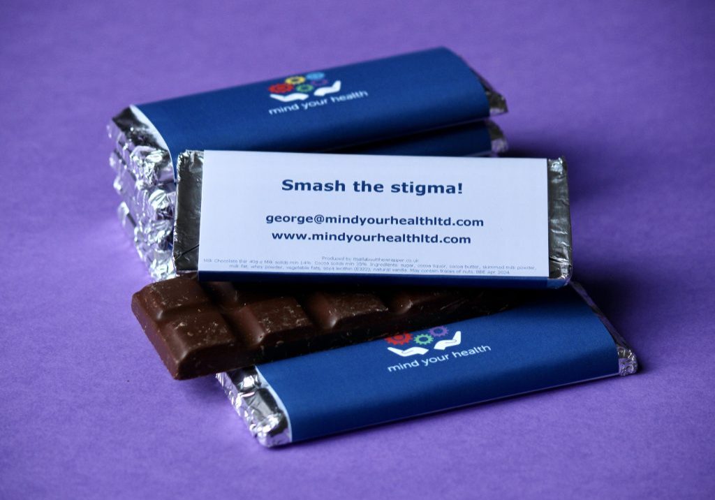 Mind Your Health Branded chocolate bars with a QR code on the wrapper